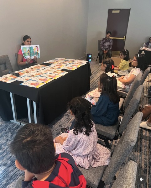 Myra at reading session with children